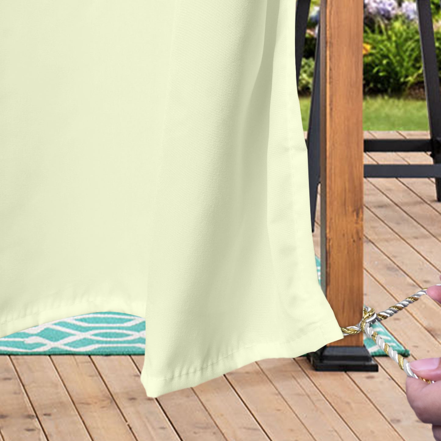 Semi-transparent, water-repellent outdoor curtain with eyelets for patio and balcony
