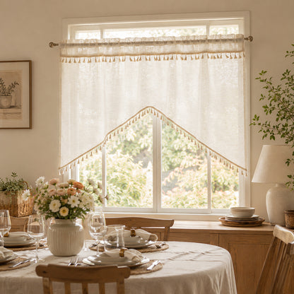 Arched cafe curtain in a linen blend with tassels in a country style