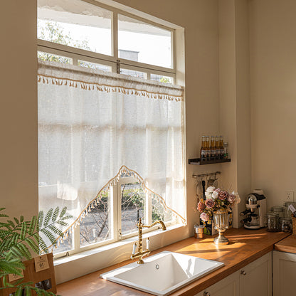 Arched cafe curtain in a linen blend with tassels in a country style