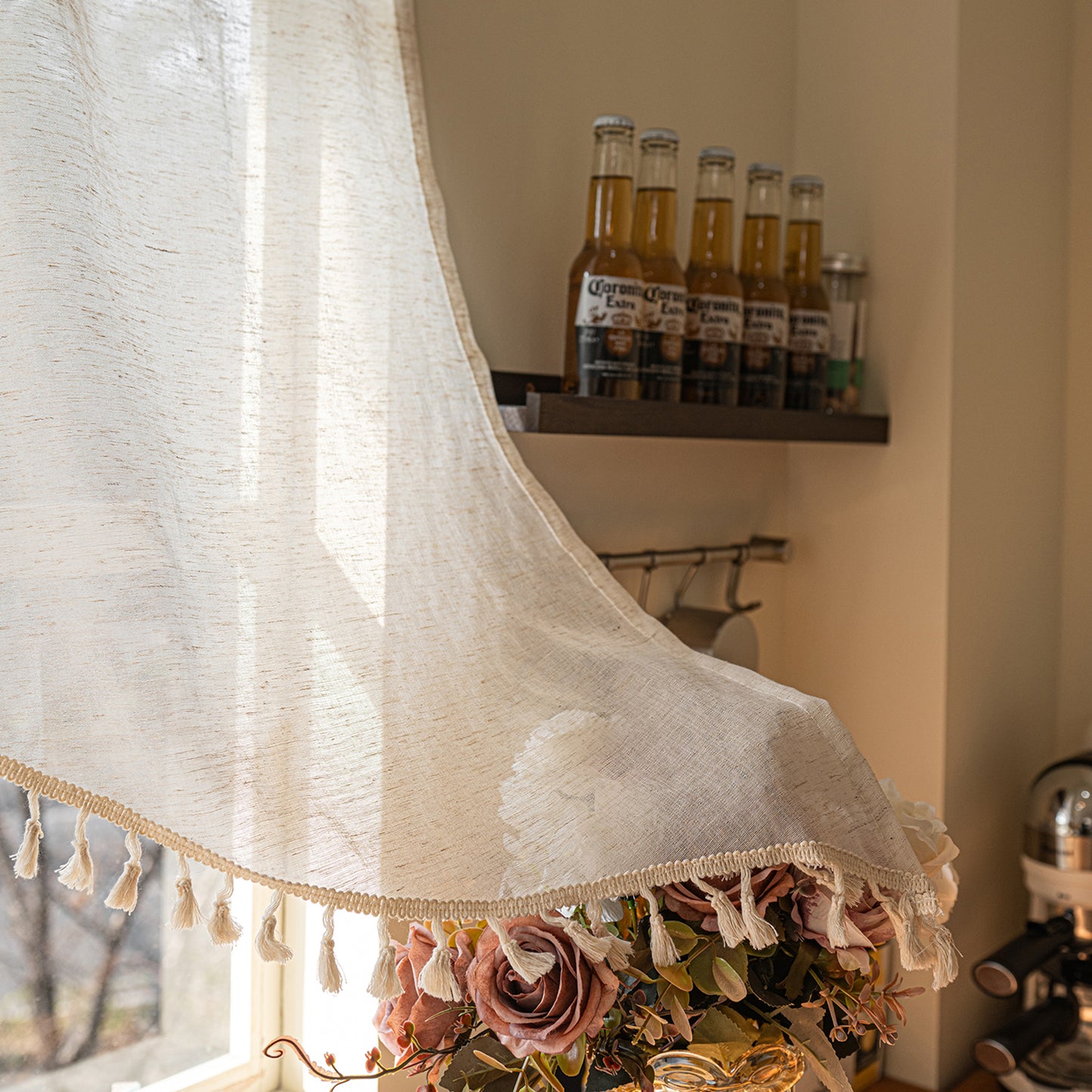 Arched cafe curtain in a linen blend with tassels in a country style