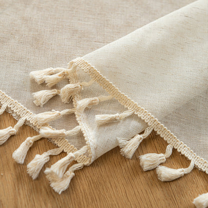 Arched cafe curtain in a linen blend with tassels in a country style