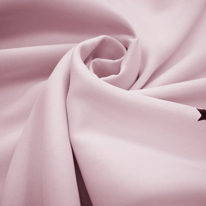 Blackout curtain with cut-out stars and overlay design