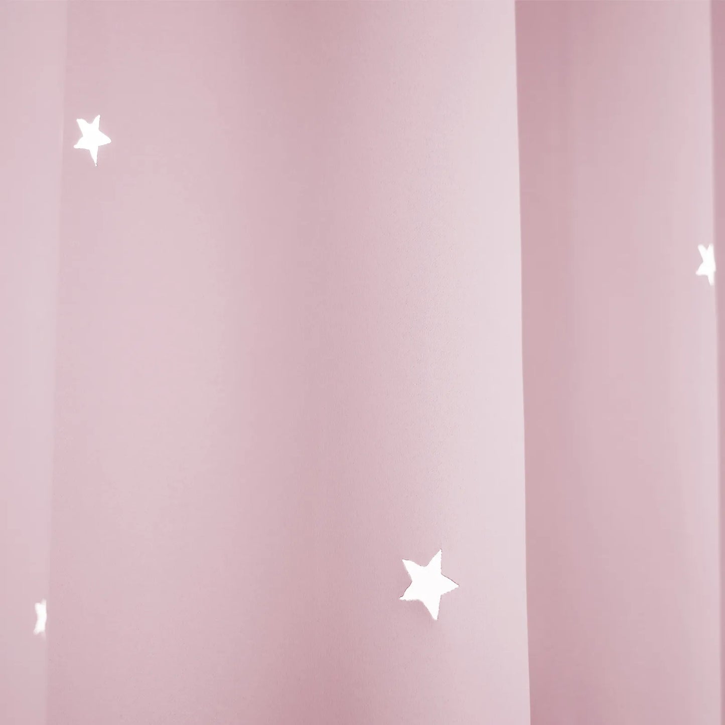 Blackout curtain with cut-out stars and overlay design