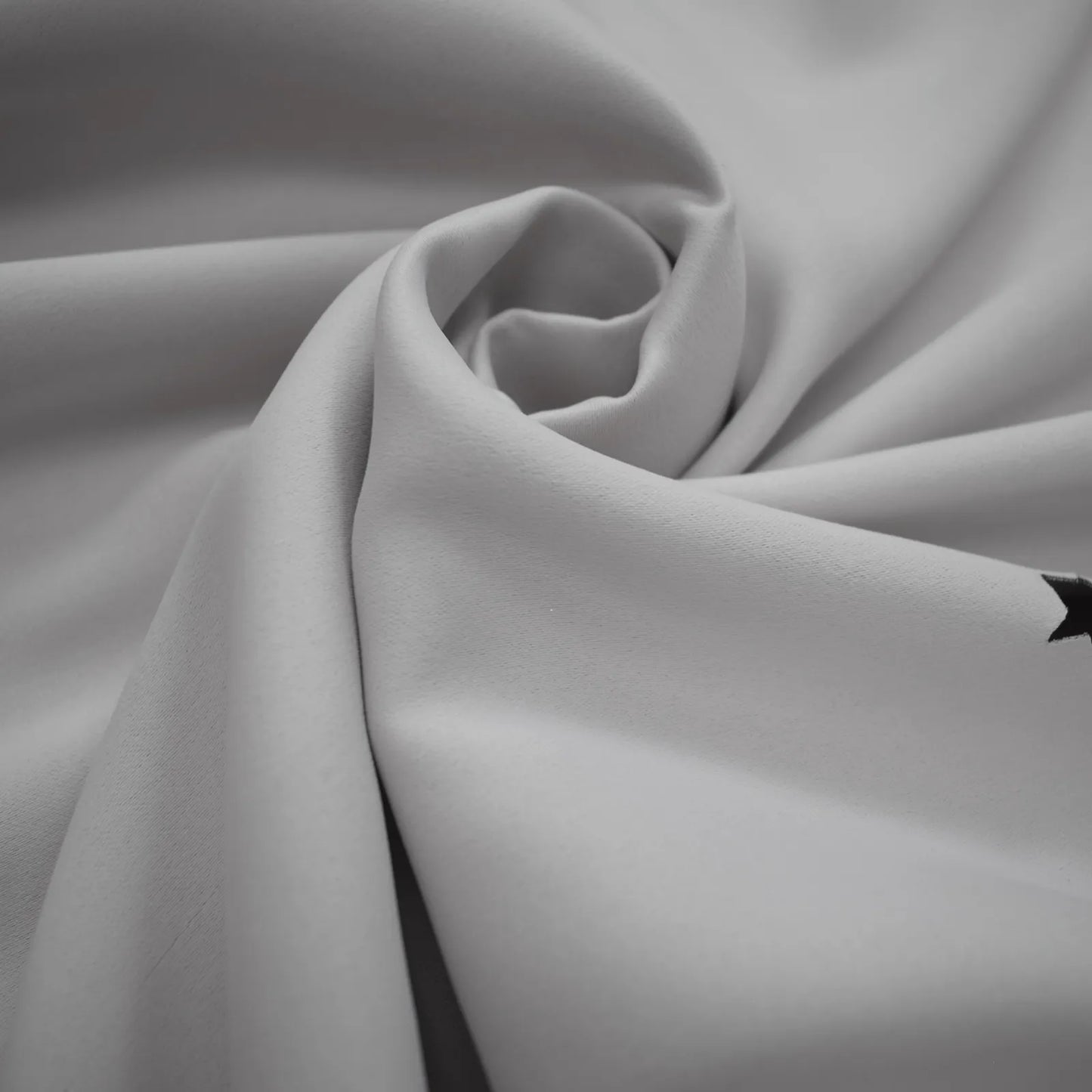 Blackout curtain with cut-out stars and overlay design