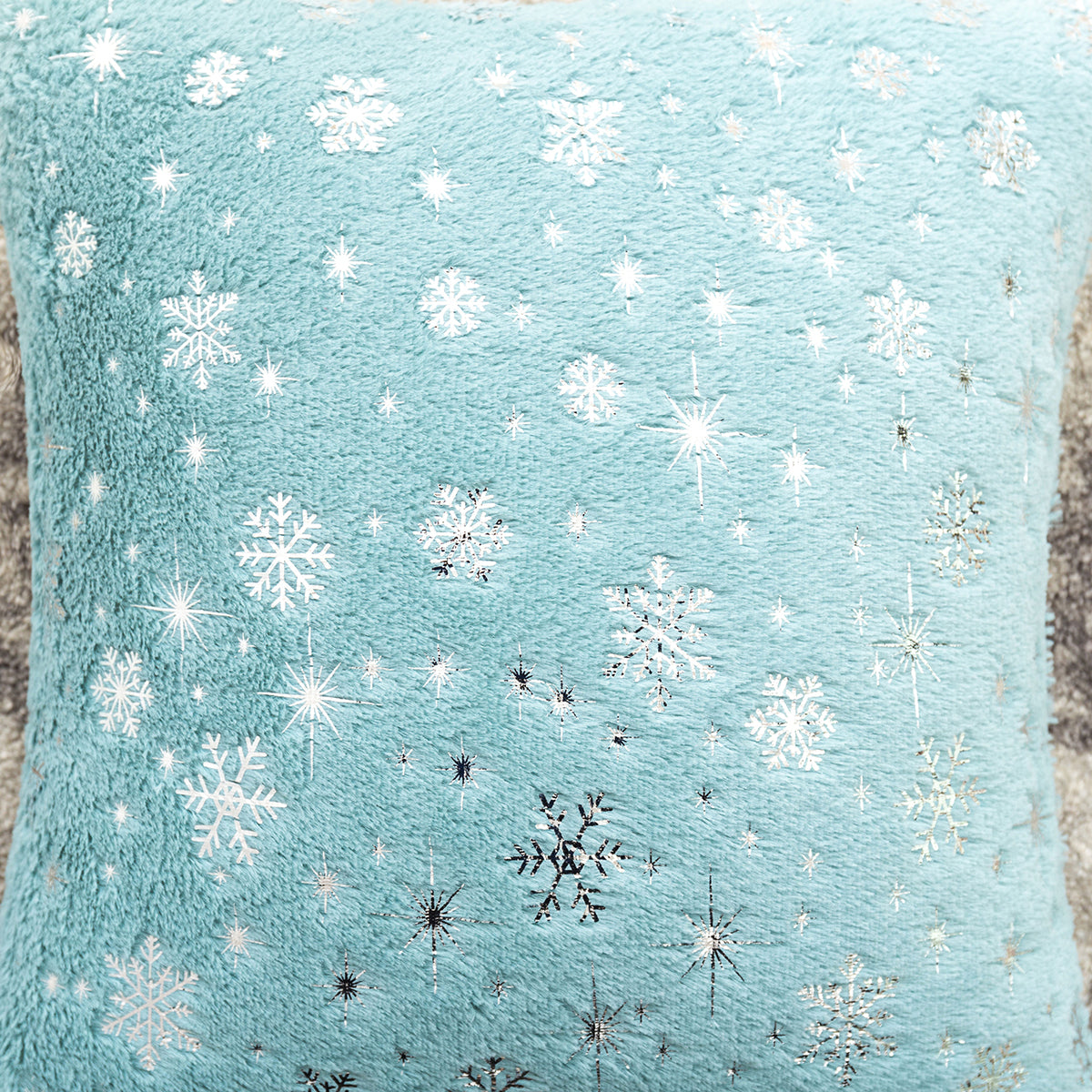 Soft plush pillowcase with snowflakes and gold embossing