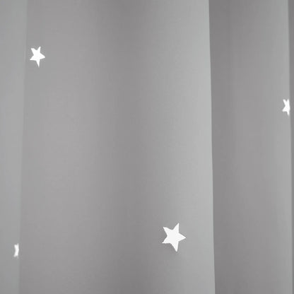 Blackout curtain with cut-out stars and overlay design
