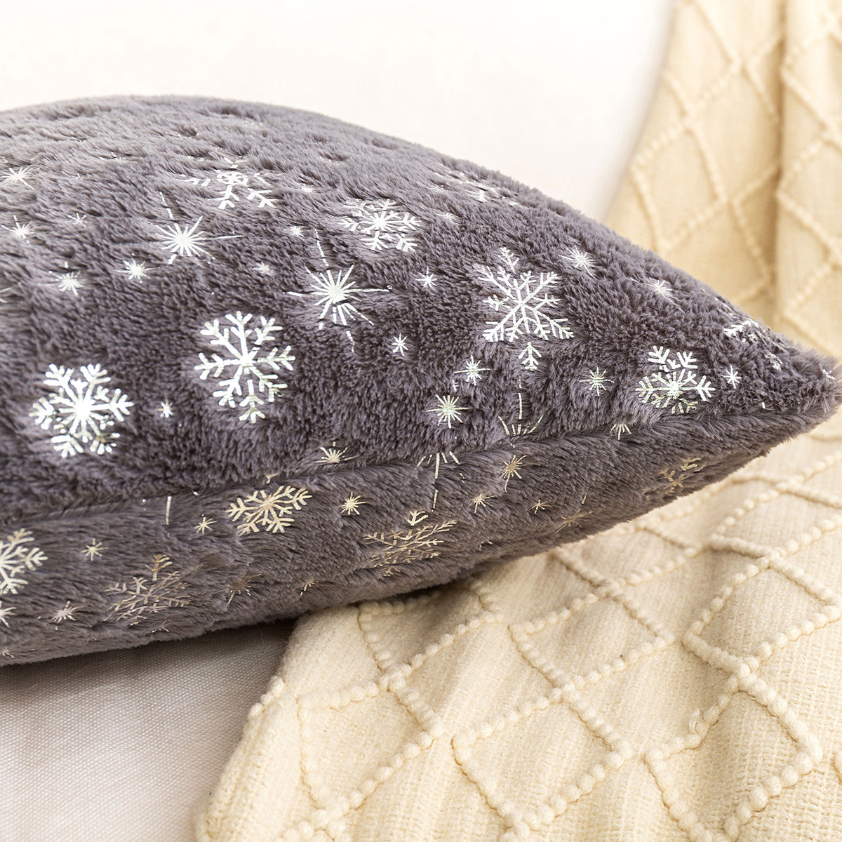 Soft plush pillowcase with snowflakes and gold embossing