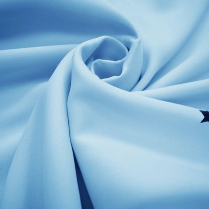 Blackout curtain with cut-out stars and overlay design